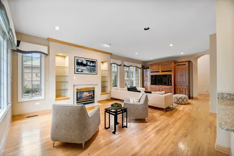 a living room with fireplace furniture and a flat screen tv