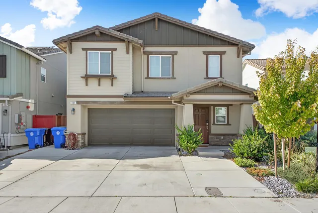 a front view of a house with yard