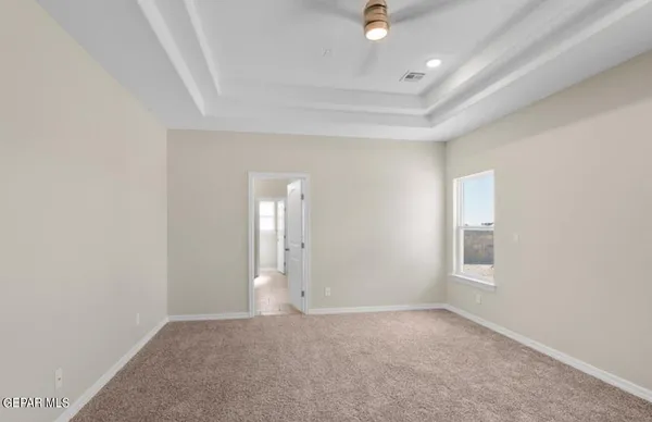 an empty room with a empty space and windows