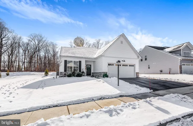a view of a house with snow