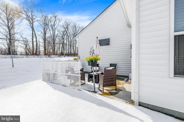 a view of a chairs and table in the patio