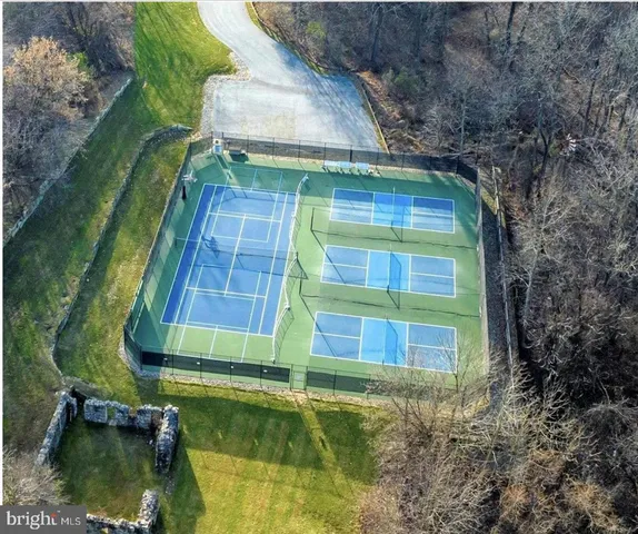 a small pool with trees in the background