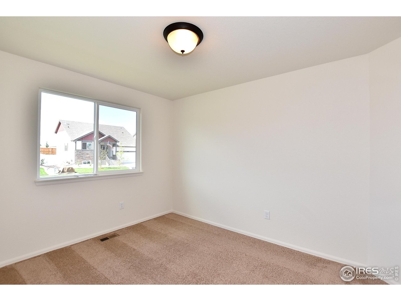 612 87th Avenue Greeley, CO 80634 - Photo 29 of 37 a view of empty room with window