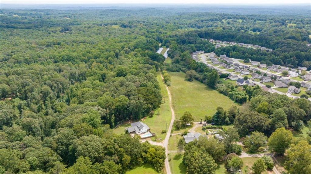 0 Caudell Drive Lula, GA 30554 - Photo 5 of 38 an aerial view of a residential houses with outdoor space and trees