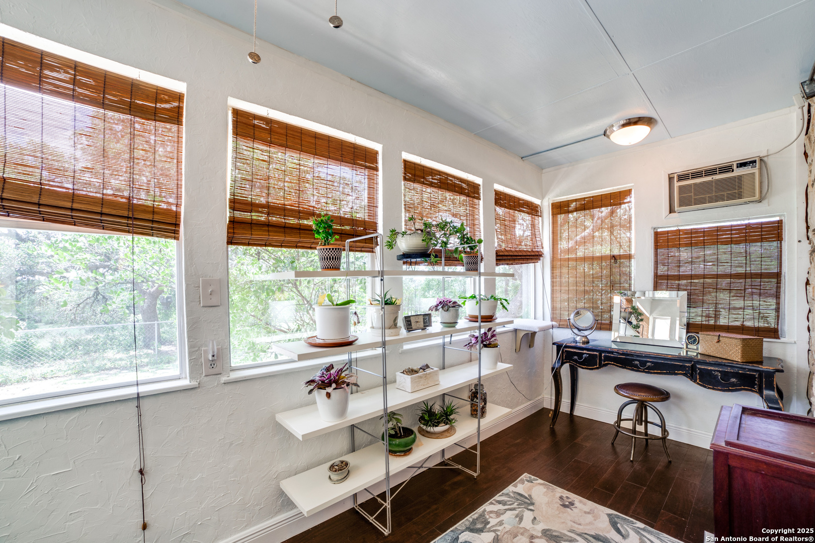 20892 Bluehill Pass Helotes, TX 78023 - Photo 11 of 36 a room with furniture and large windows
