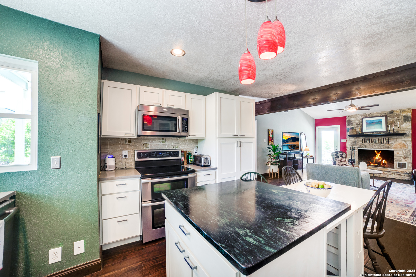 20892 Bluehill Pass Helotes, TX 78023 - Photo 27 of 36 a kitchen with stainless steel appliances granite countertop a sink dishwasher and cabinets with wooden floor