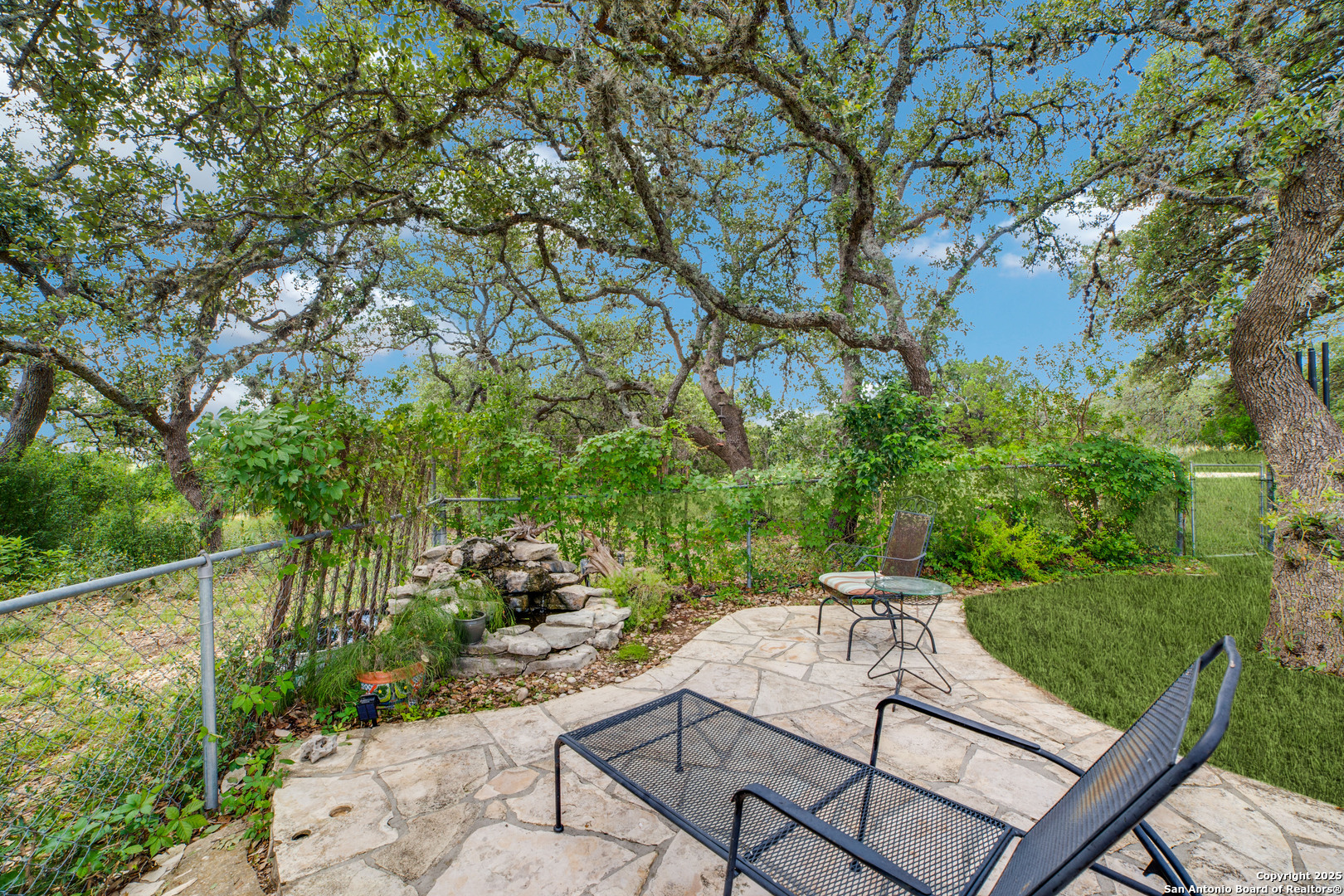 20892 Bluehill Pass Helotes, TX 78023 - Photo 3 of 36 a view of a backyard with sitting area