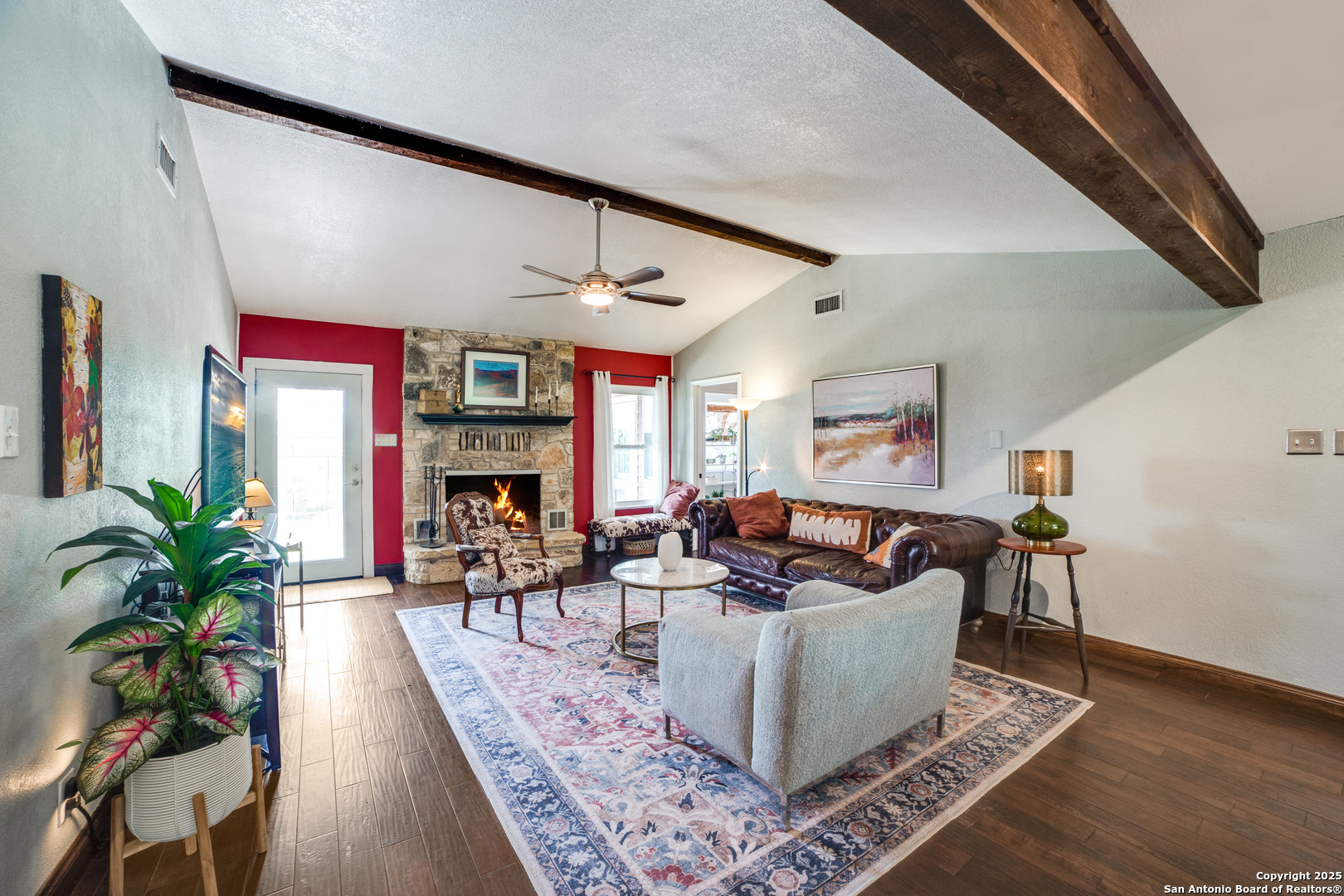 20892 Bluehill Pass Helotes, TX 78023 - Photo 32 of 36 a living room with furniture and a fireplace