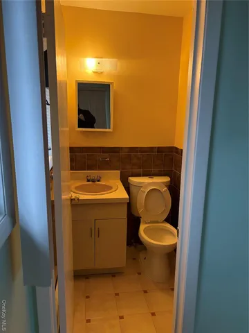 a bathroom with a toilet and a sink