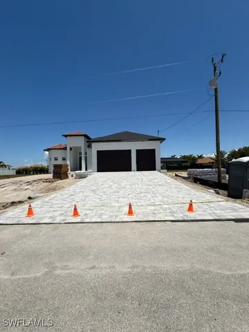a view of the street with cars