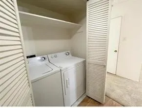 an empty room with a ceiling fan and a fan