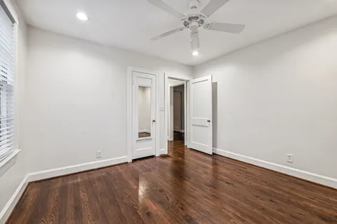 a bathroom with a sink toilet and mirror