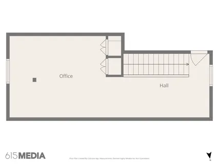 a view of a brick building next to a yard