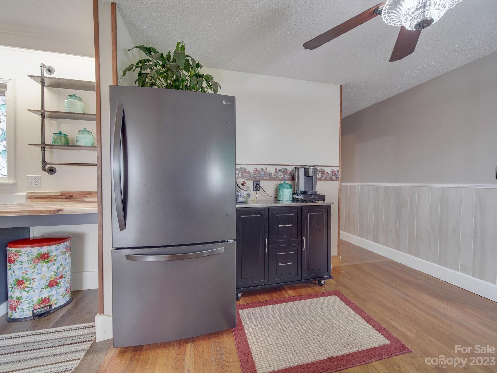 4197 Stallings Road Harrisburg, NC 28075 - Photo 12 of 41 a kitchen with stainless steel appliances granite countertop a refrigerator and a stove