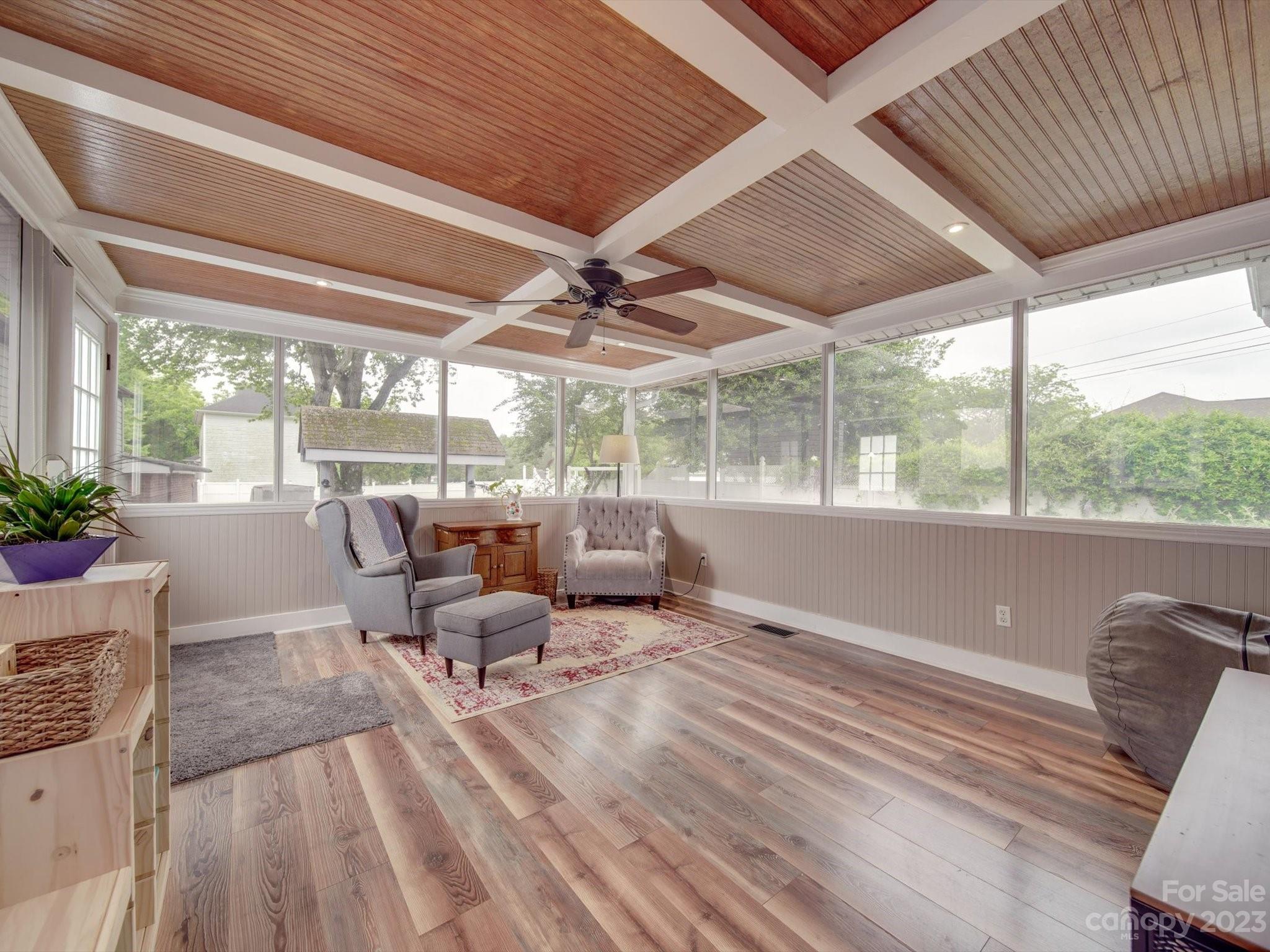 4197 Stallings Road Harrisburg, NC 28075 - Photo 23 of 41 a living room with furniture and large windows