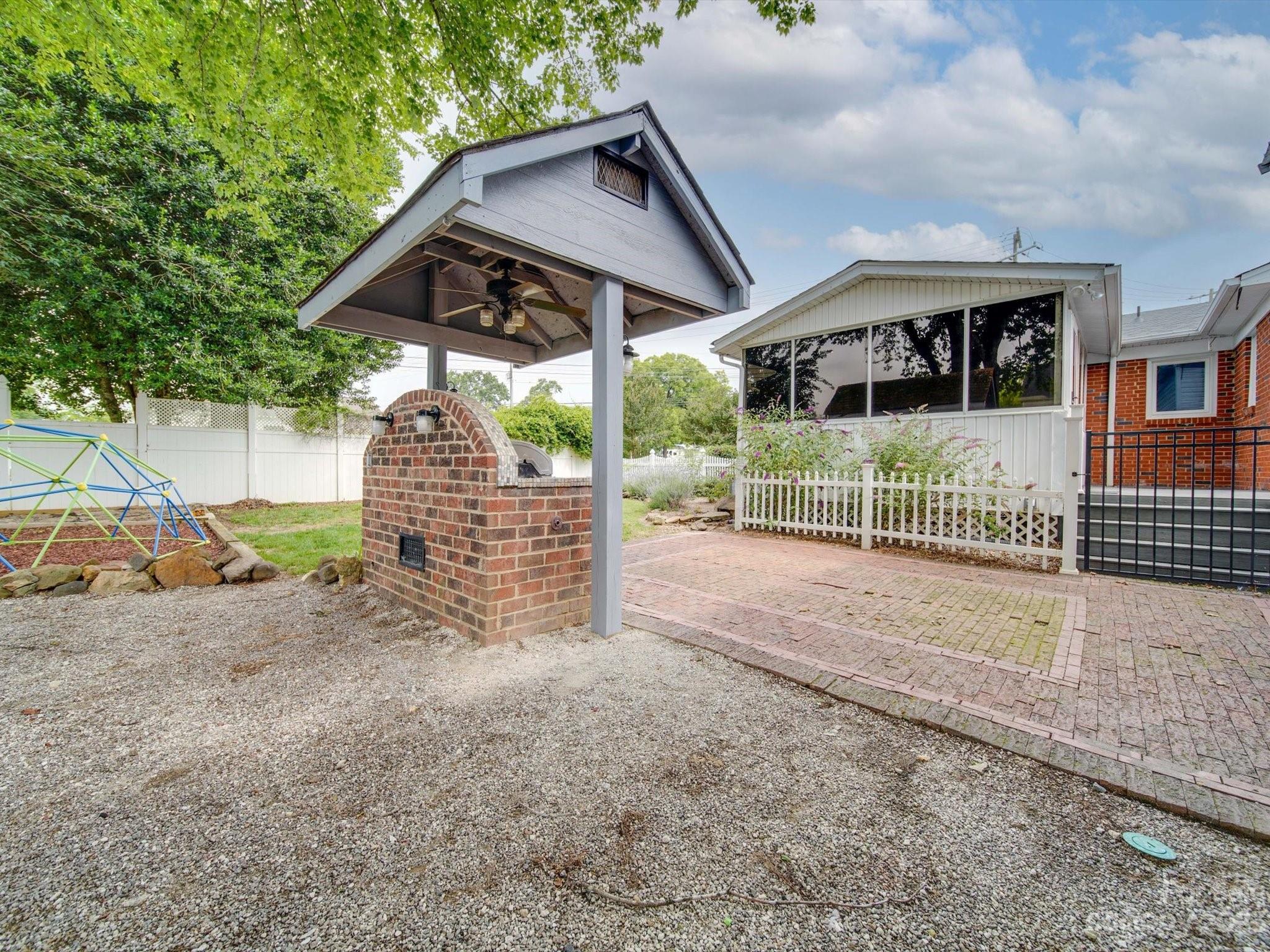 4197 Stallings Road Harrisburg, NC 28075 - Photo 30 of 41 a view of house with a yard