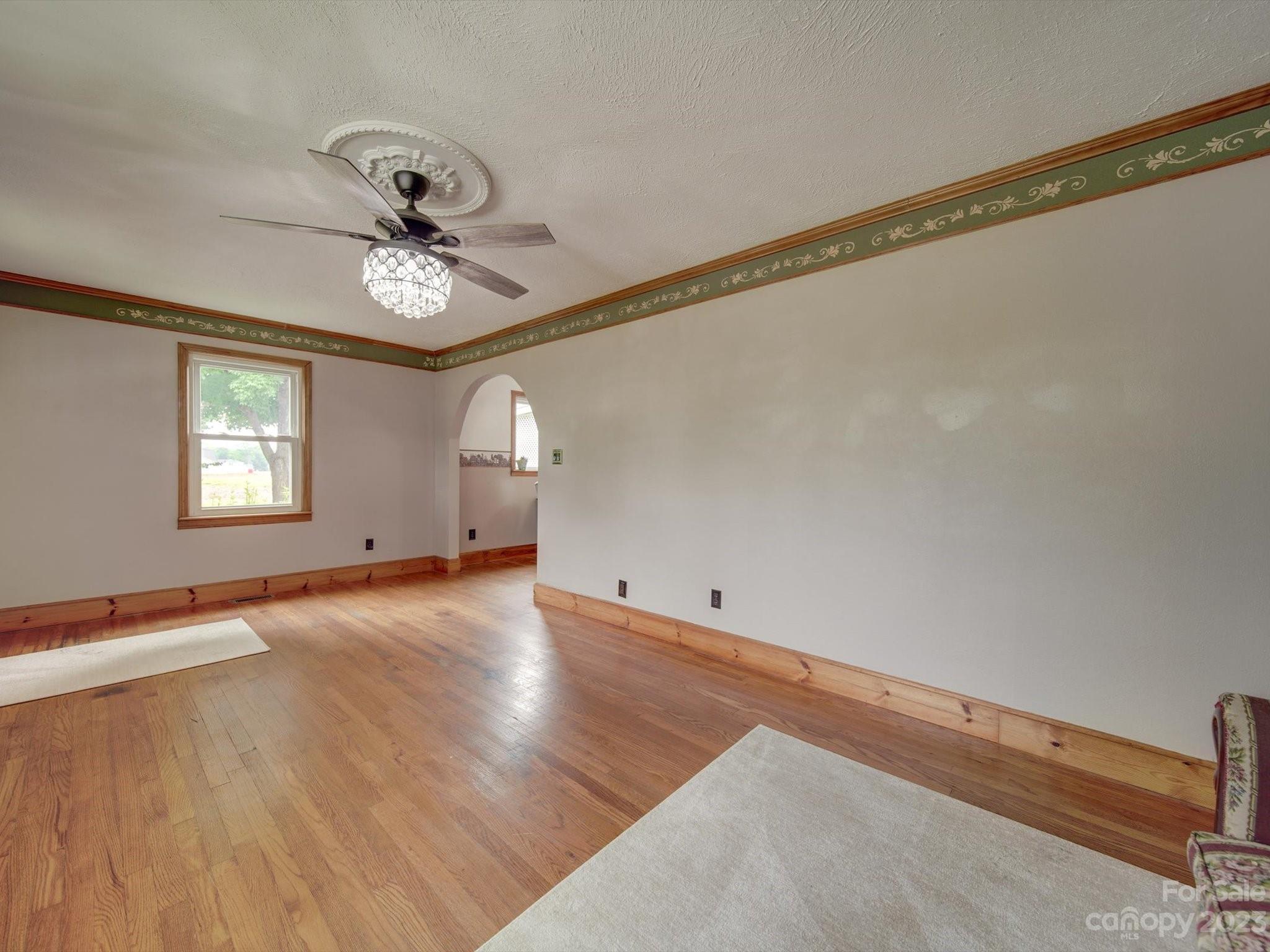 4197 Stallings Road Harrisburg, NC 28075 - Photo 5 of 41 a view of an empty room with a window