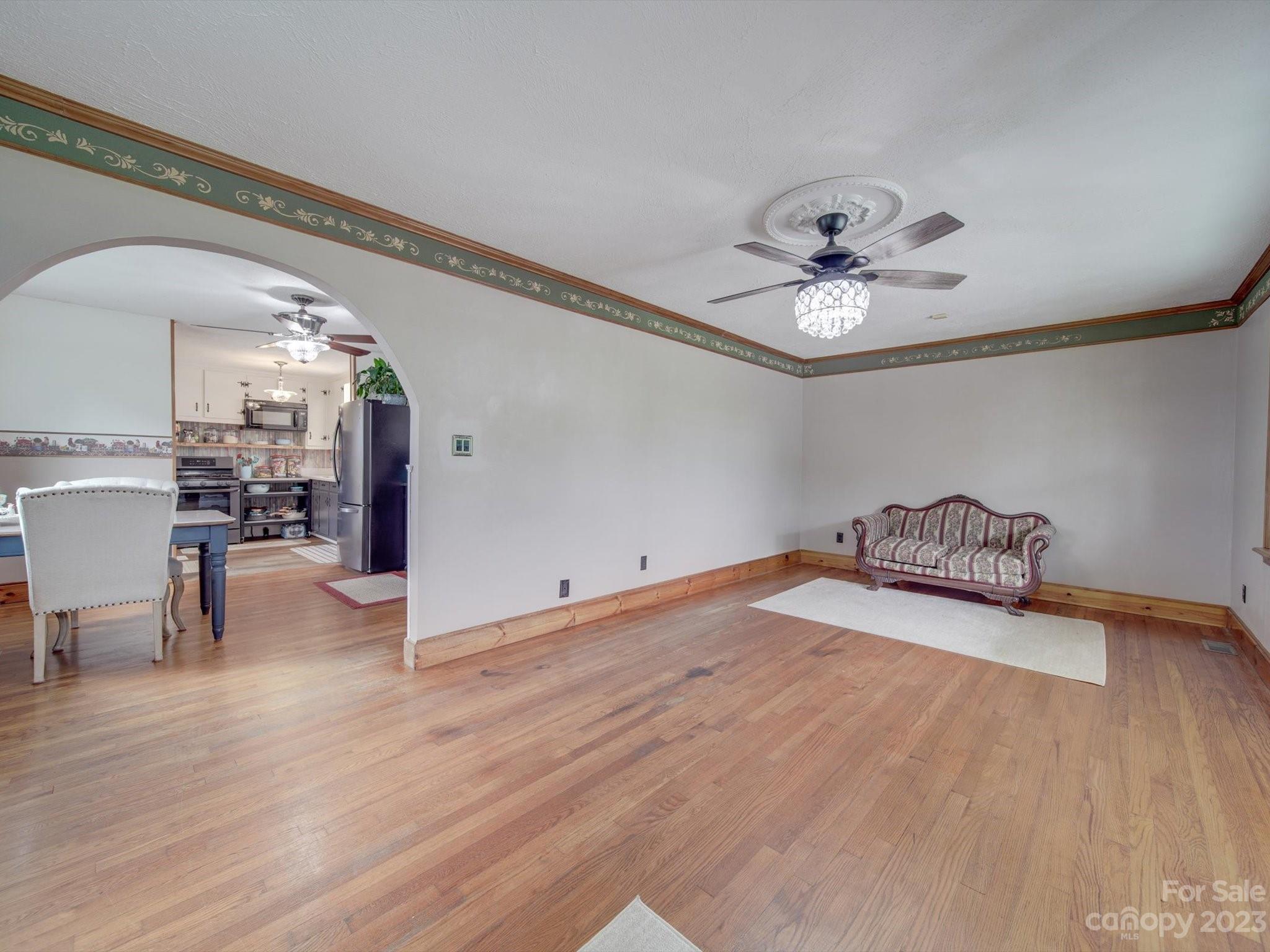 4197 Stallings Road Harrisburg, NC 28075 - Photo 6 of 41 a view of a bedroom with furniture and wooden floor