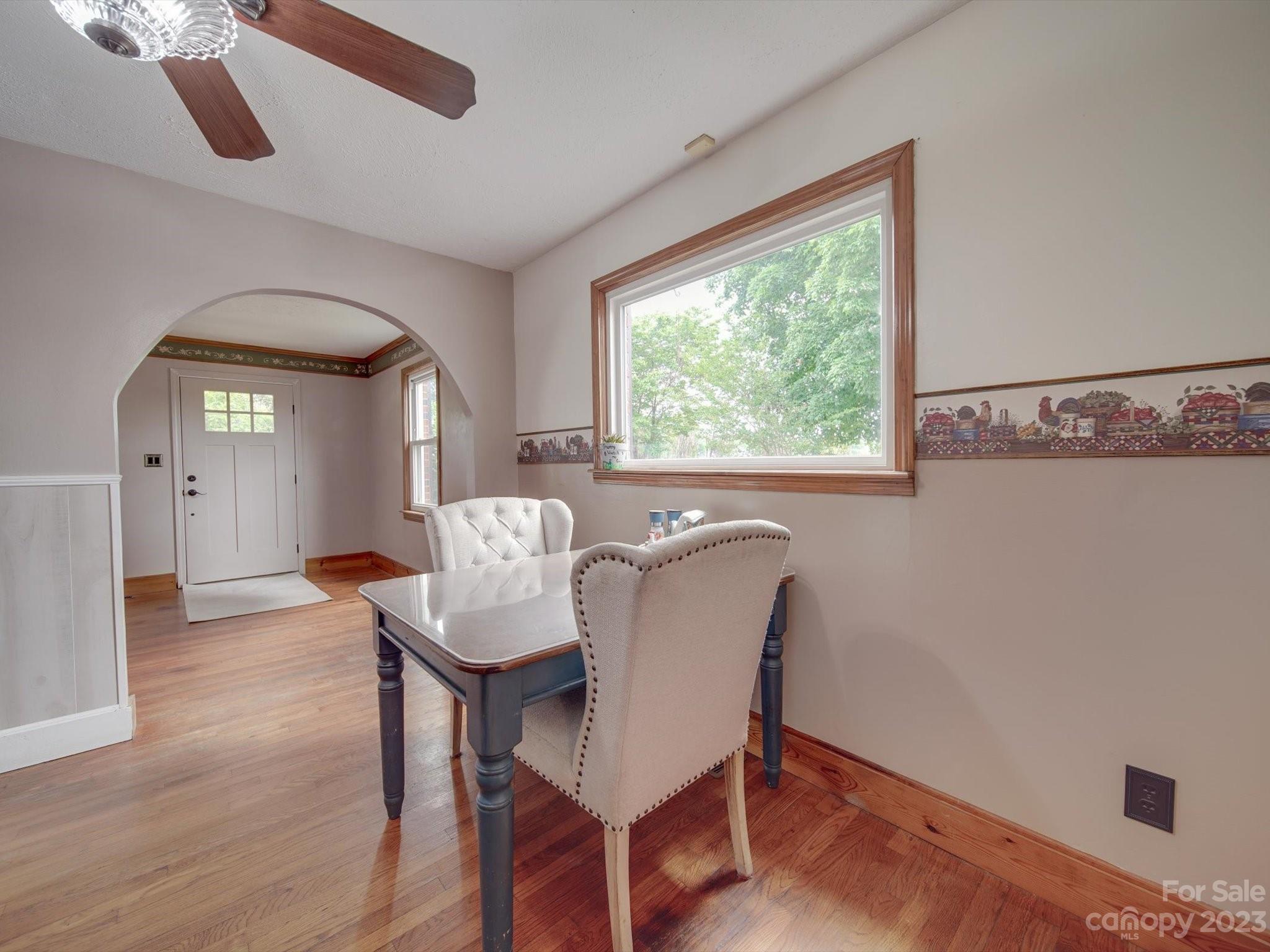 4197 Stallings Road Harrisburg, NC 28075 - Photo 7 of 41 a view of a dining room with furniture window and wooden floor