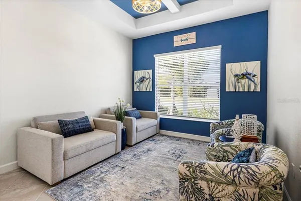 a living room with furniture and a window
