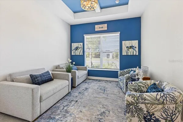 a bedroom with a bed and a couch