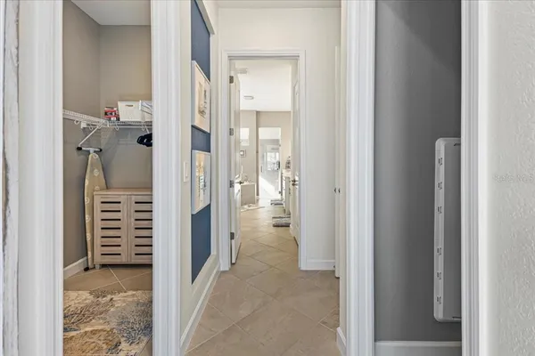 a spacious bathroom with double sink and a large mirror