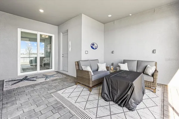a front view of house with yard swimming pool and outdoor seating