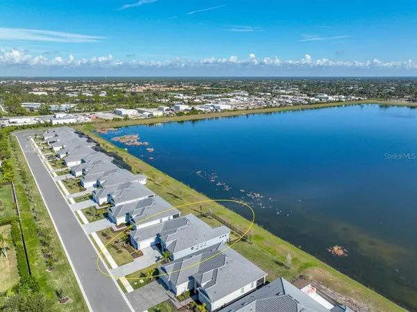 an aerial view of a house with a ocean view