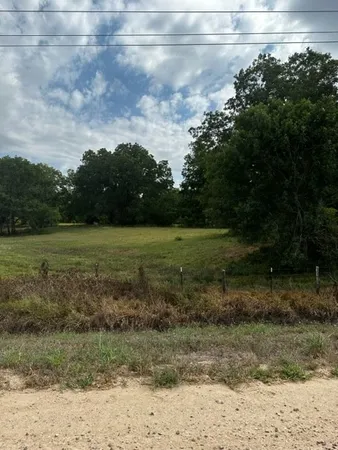 a view of a lake with a big yard