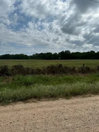 a view of a lake with a big yard