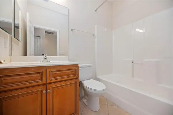 a bathroom with a double vanity sink mirror and