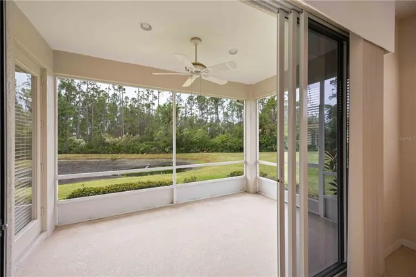 a view of a balcony with dining table and chairs with wooden floor