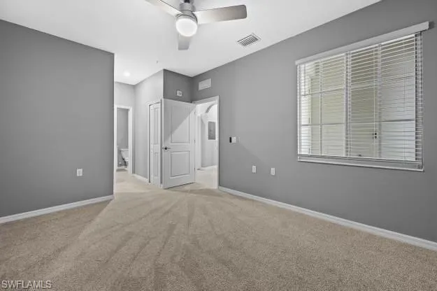 a view of an empty room with a window