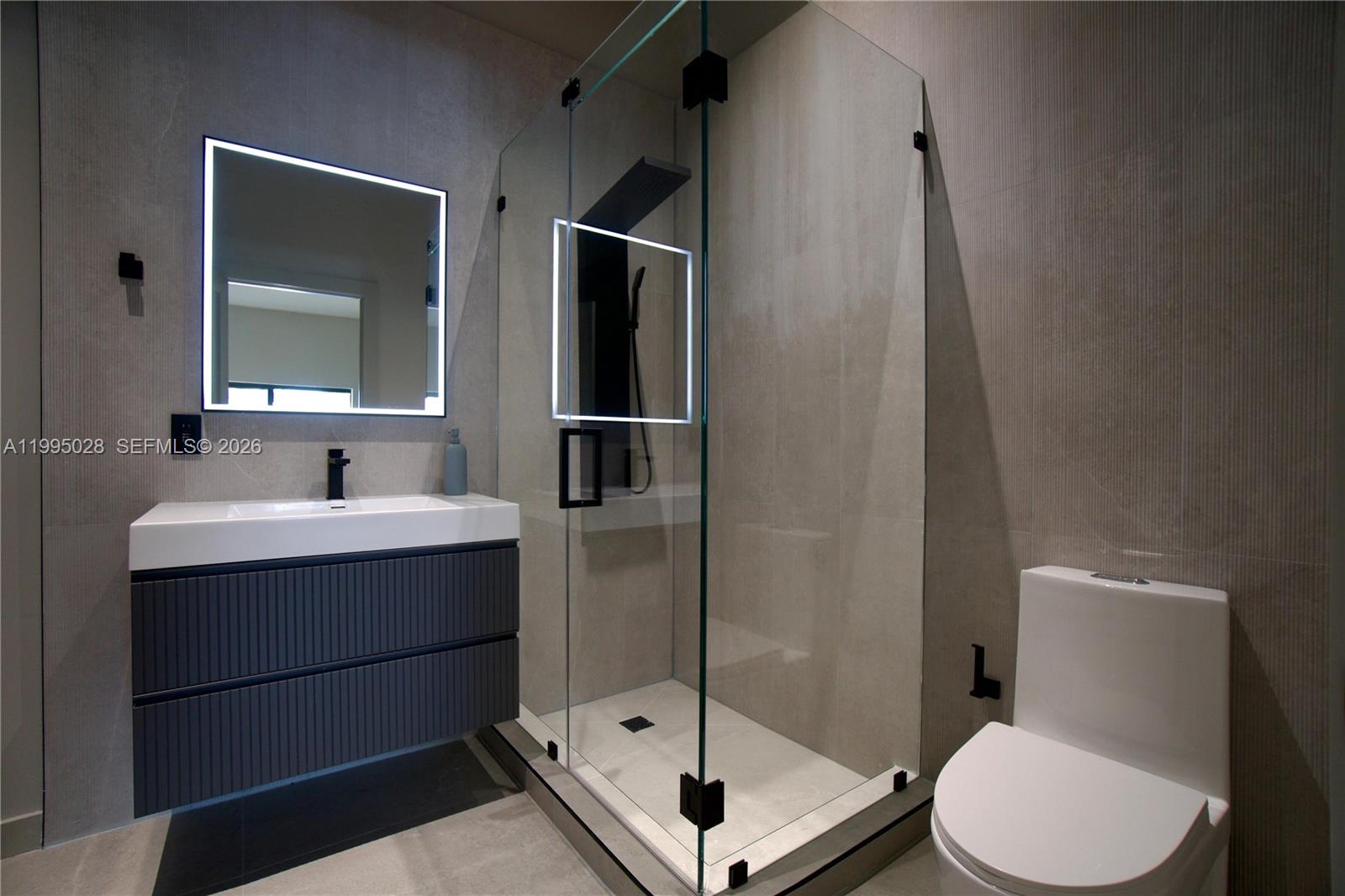 2155 Southwest 25th Terrace Miami, FL 33133 - Photo 13 of 13 a bathroom with a sink toilet and shower