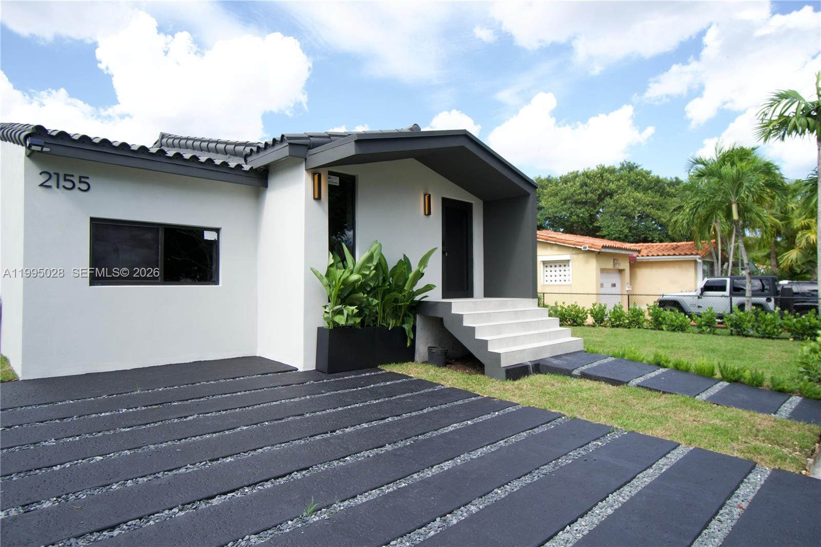 2155 Southwest 25th Terrace Miami, FL 33133 - Photo 2 of 13 a view of a house with a patio