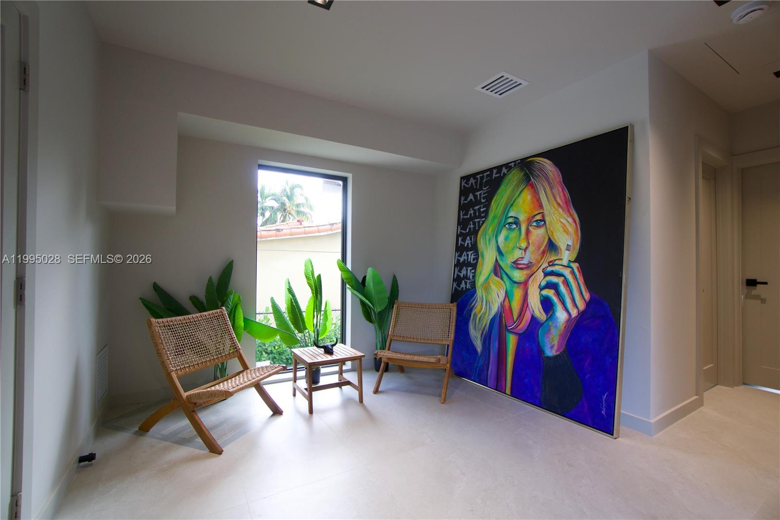 2155 Southwest 25th Terrace Miami, FL 33133 - Photo 8 of 13 a living room with furniture and wall paintings