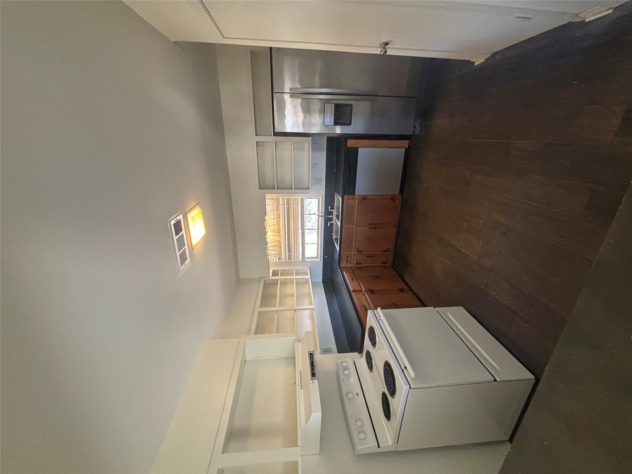 2324 Hartford Road Austin, TX 78703 - Photo 3 of 20 a kitchen with stainless steel appliances granite countertop a stove a sink and a refrigerator