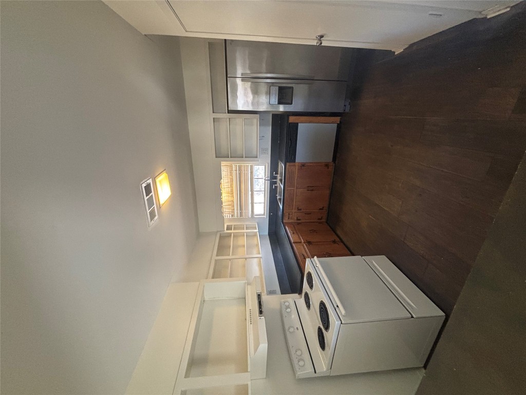 2324 Hartford Road Austin, TX 78703 - Photo 3 of 20 a kitchen with stainless steel appliances granite countertop a stove a sink and a refrigerator