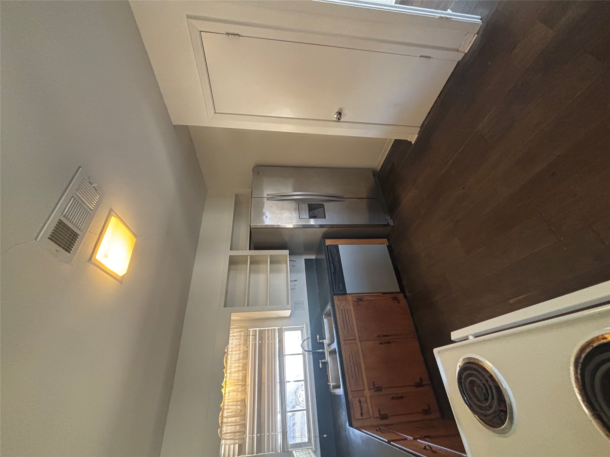 2324 Hartford Road Austin, TX 78703 - Photo 5 of 20 a kitchen with granite countertop a sink and a refrigerator