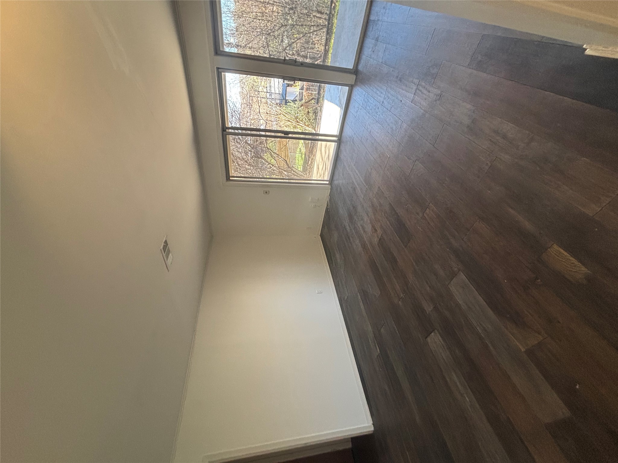 2324 Hartford Road Austin, TX 78703 - Photo 8 of 20 an empty room with wooden floor and windows