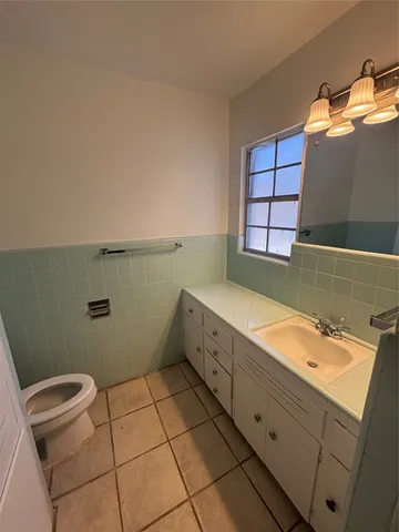 a bathroom with a sink and a toilet