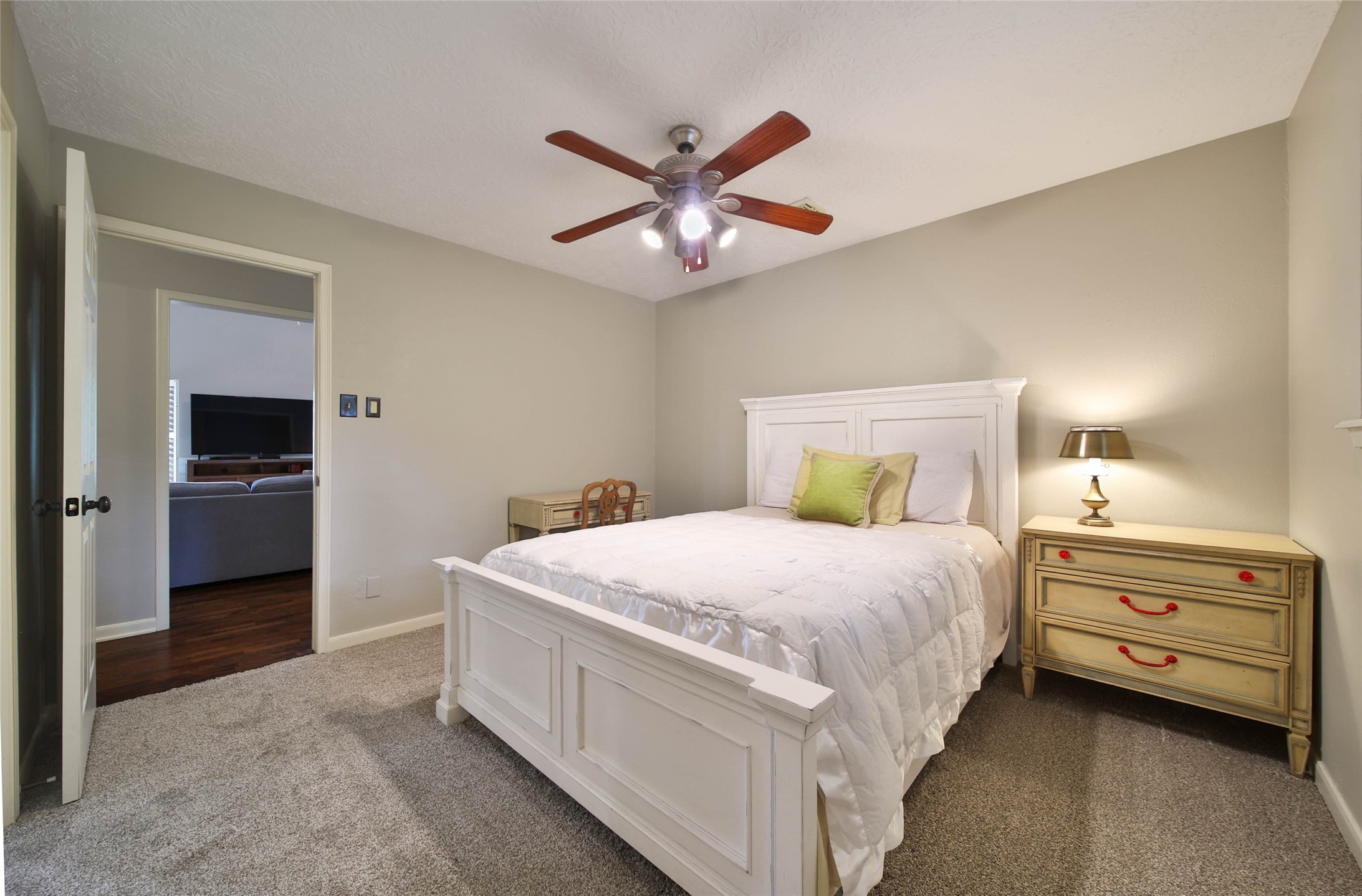 17007 Windrow Drive Spring, TX 77379 - Photo 33 of 46 a bedroom with a bed and a chandelier