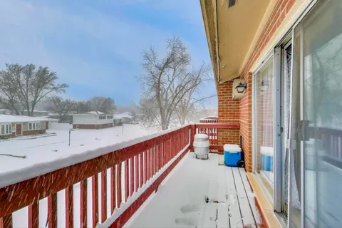 a view of balcony with furniture