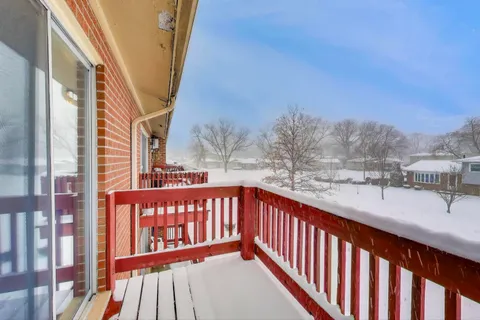 a view of a balcony with furniture