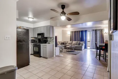 a kitchen with cabinets and stainless steel appliances