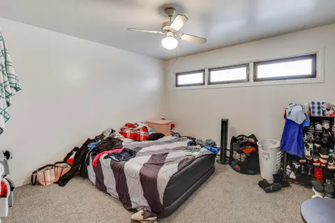 a bed room with a bed and a lamp