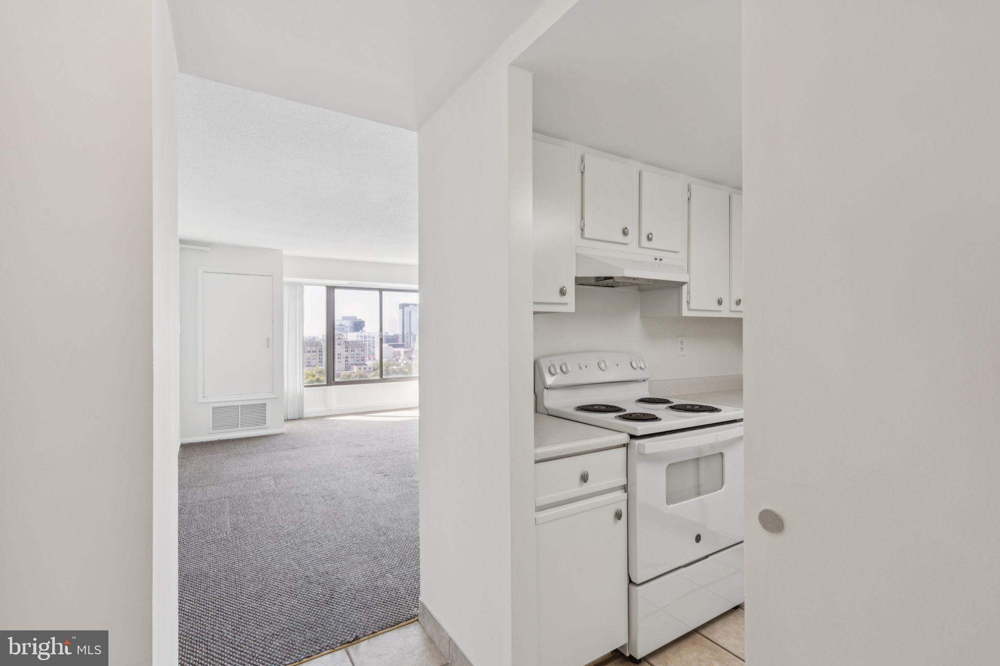 2001 Hamilton Street, Unit 1520 Philadelphia, PA 19130 - Photo 2 of 4 a kitchen with white cabinets and appliances