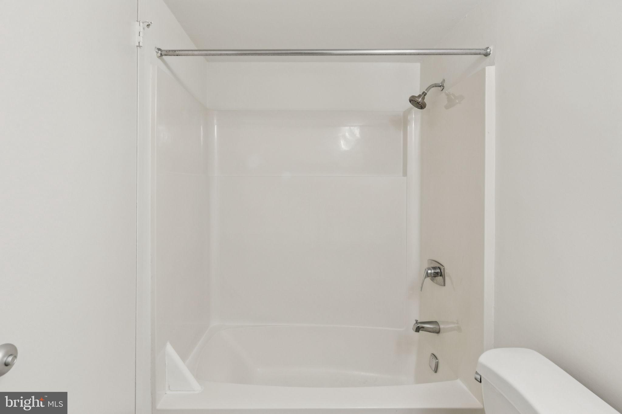 2001 Hamilton Street, Unit 1520 Philadelphia, PA 19130 - Photo 3 of 4 a bathroom with a shower and a toilet