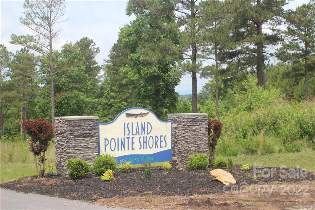 2048 Inlet Shore Road Northeast, Unit 25 Connelly Springs, NC 28612 - Photo 11 of 11 a view of a sign board and a yard
