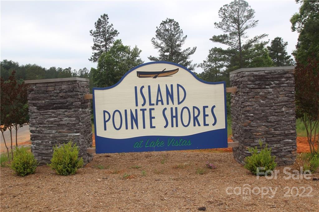 2048 Inlet Shore Road Northeast, Unit 25 Connelly Springs, NC 28612 - Photo 5 of 11 a sign that is sitting on the side of a building